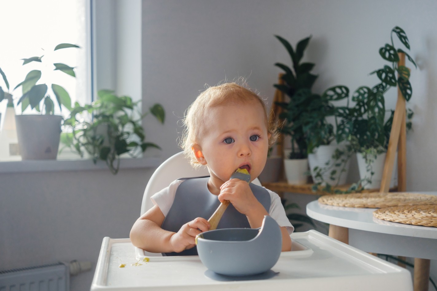 A baby eating independently A baby eating independently