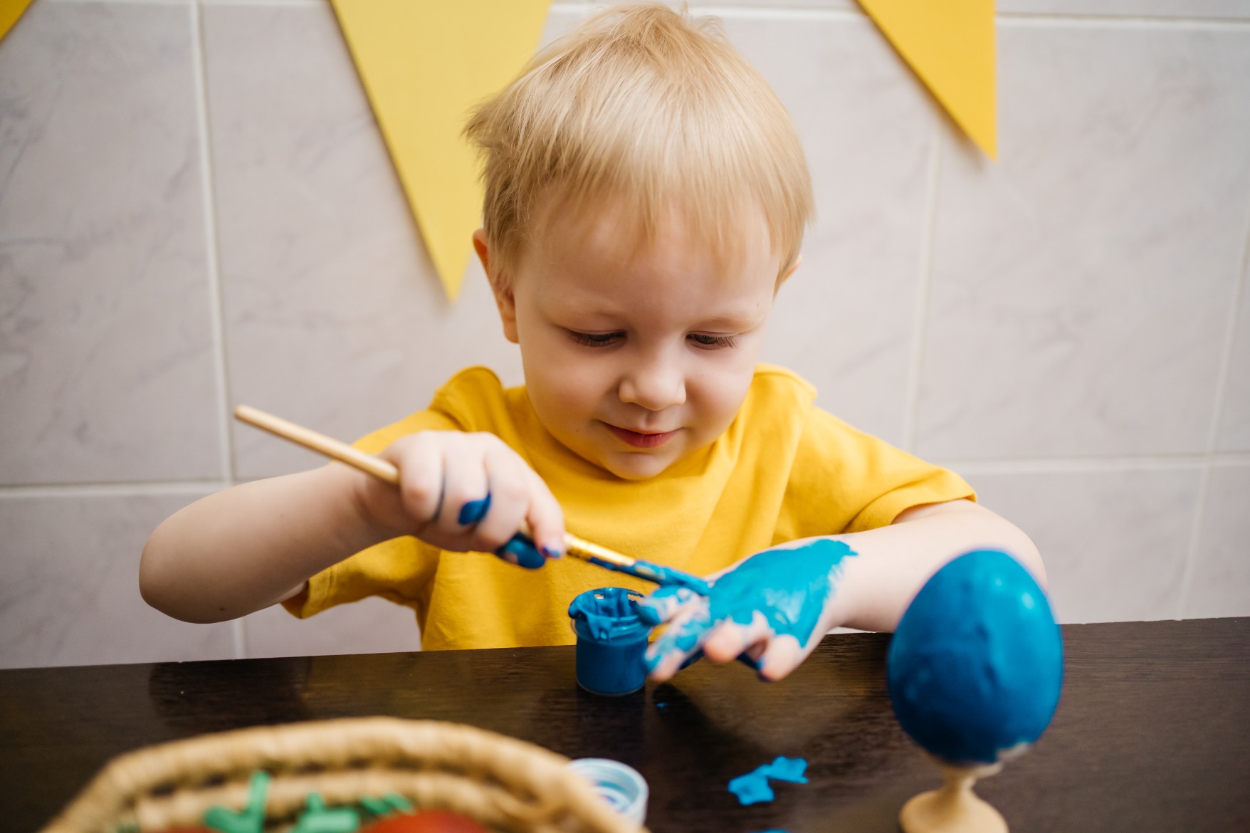 A child painting with watercolors A child painting with watercolors