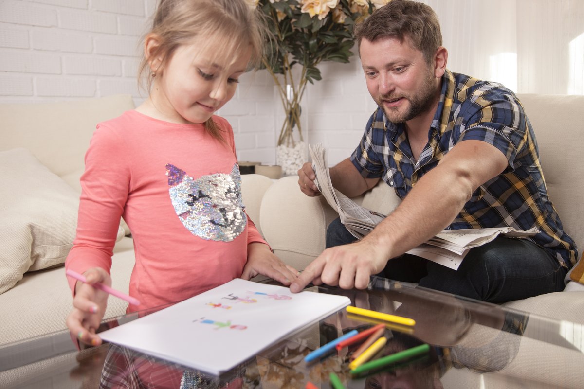 a girl and her father communicating through shared drawing a girl and her father communicating through shared drawing