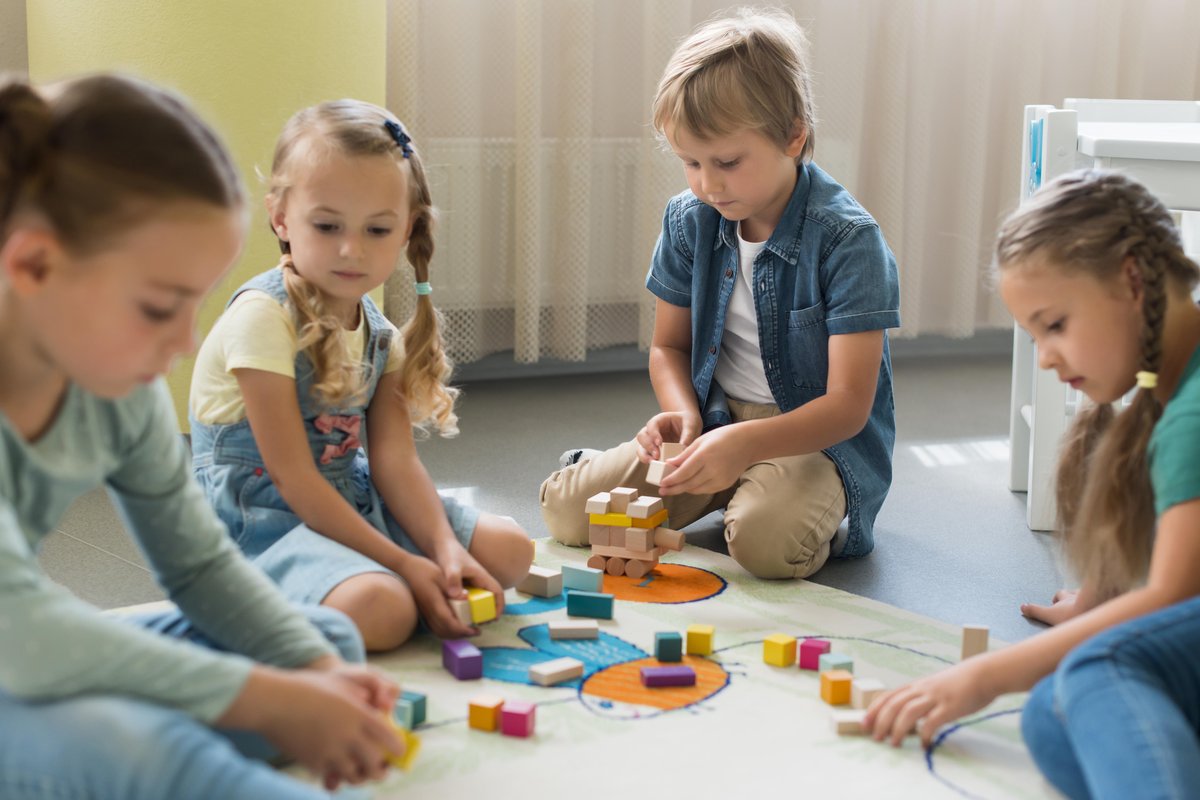 kids playing together in kindergarten kids playing together in kindergarten